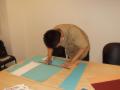 Our chief architect Wei Xing cutting the cardboard paper.