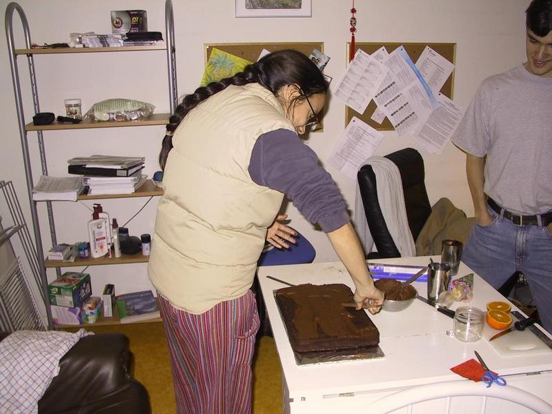Abi comes to inspect the final chocolate topping