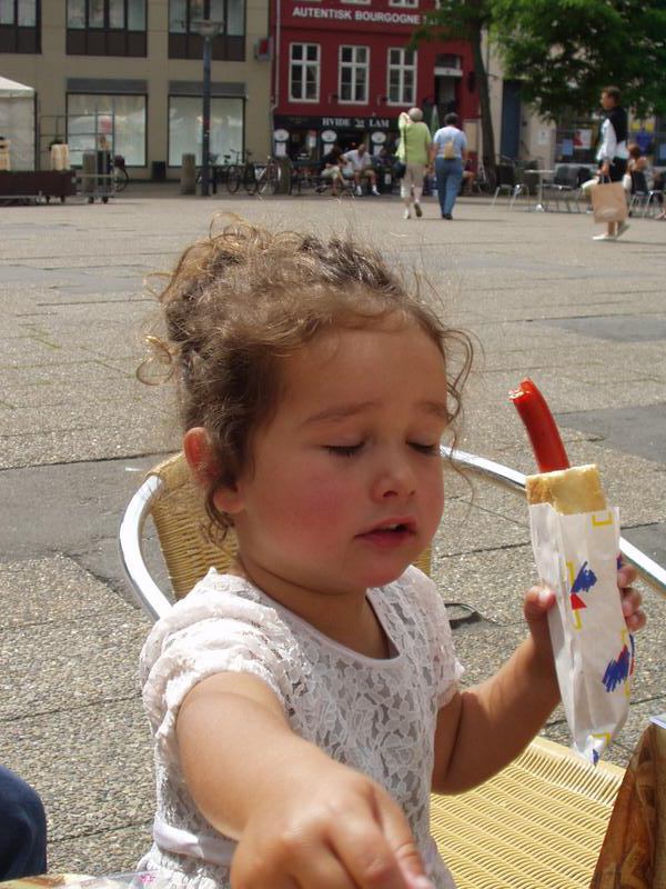 Emma eating her Danish sausage