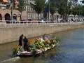 Boats are ornamented with flowers and fruits