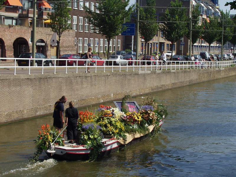 Boats are ornamented with flowers and fruits