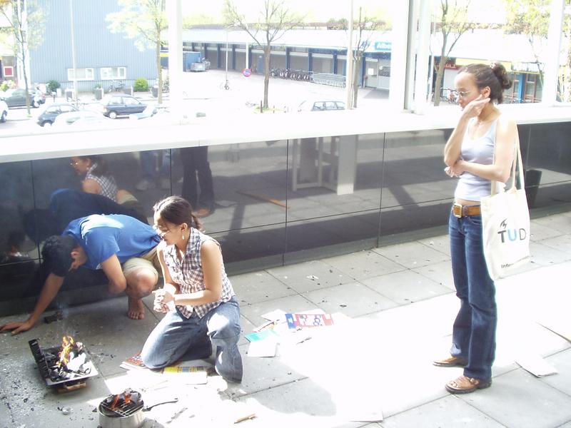 Andrea and Parag try to light up the fire, Abi supervises