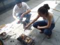 Micha and Abi roasting the meat