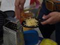 Abi preparing cheese to melt
