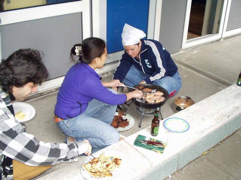 Andrea and Paige take care of the BBQ, while Clauido eats